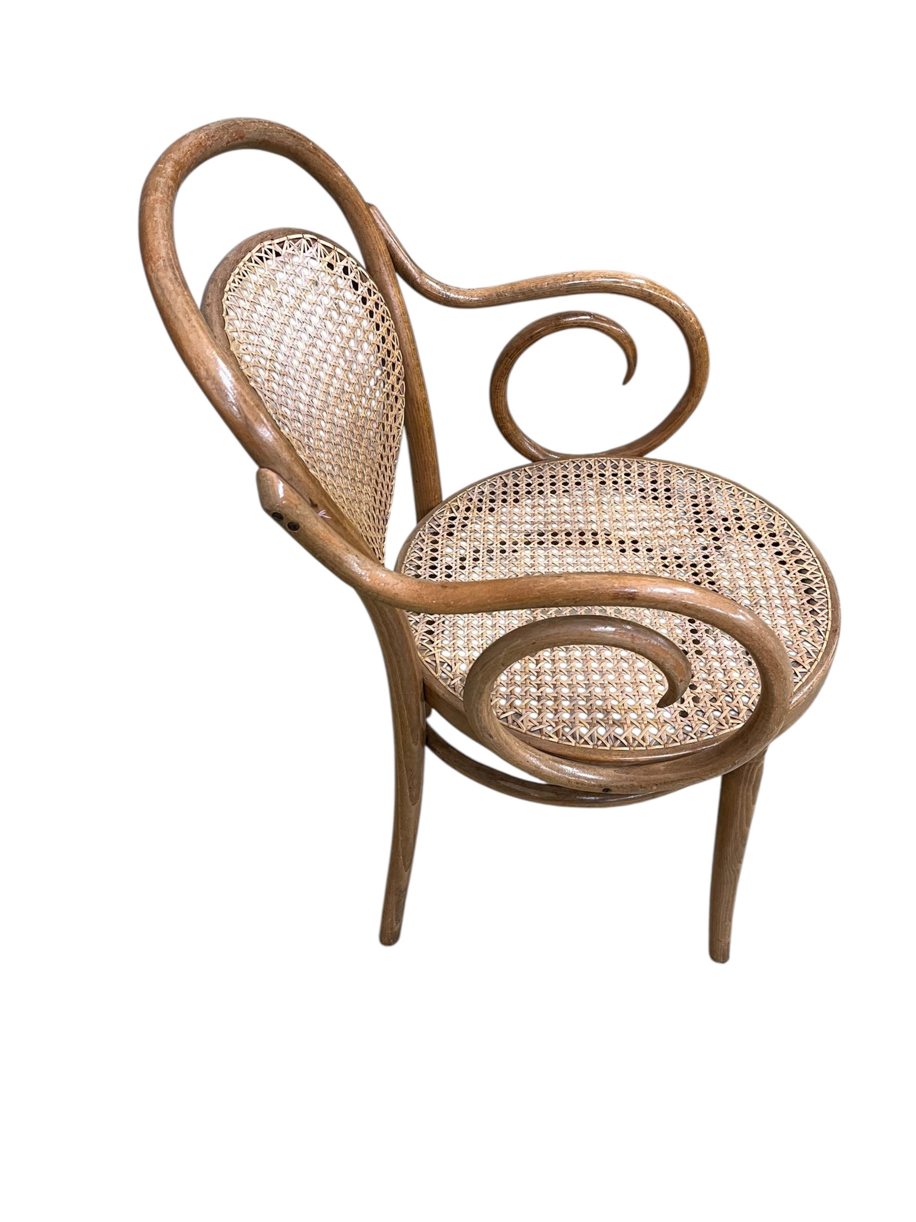 A Dinette caned beech and mahogany bentwood dining suite, comprising: dining table, width 180cm, depth 90cm, height 76cm and six elbow chairs